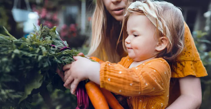 A specialty pharmacy patient and her child visiting a farmer's market